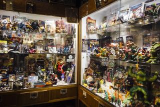 Vintage toys on display behind glass at Billy Galaxy