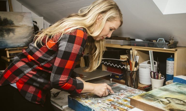 a woman creates art in a studio