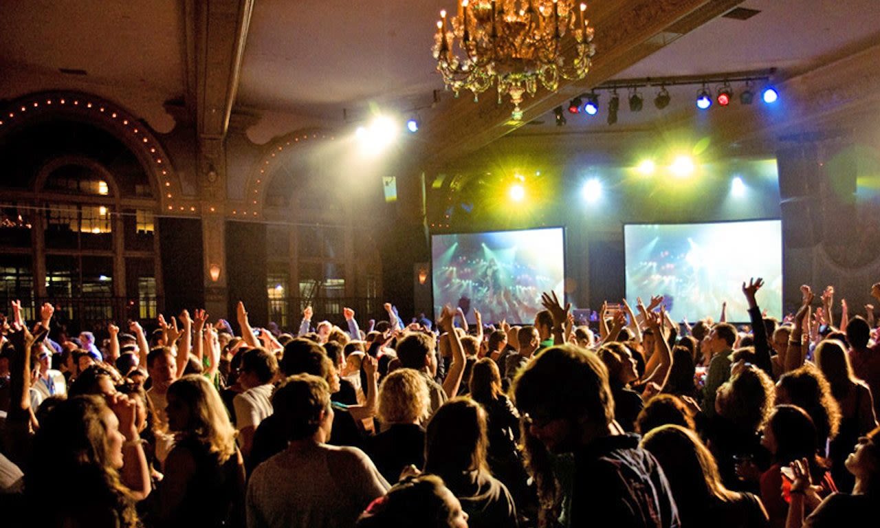 a crowd dancing at a nightclub