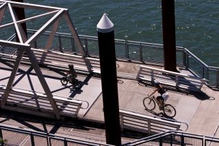 two bikers riding on the Eastbank Esplanade