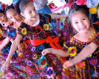 young dancers in colorful costumes