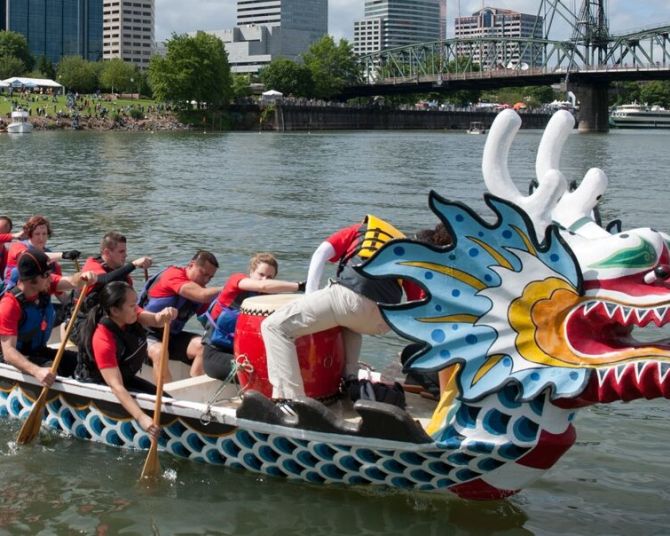 dragon boat with rowers in Wilamette River