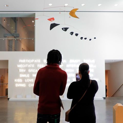 a couple observes artwork at Portland Art Museum