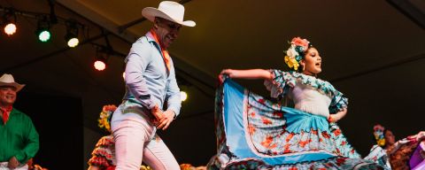 two people dancing on stage