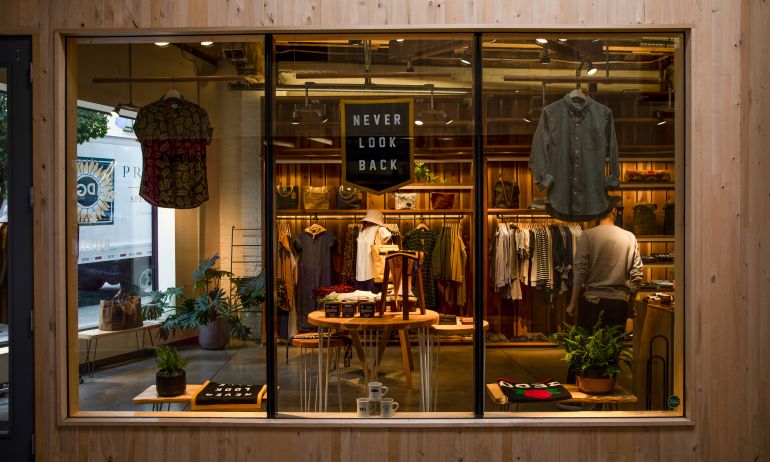 view from outside of clothing and shoes in window