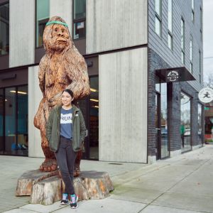 a woman in front of a statue