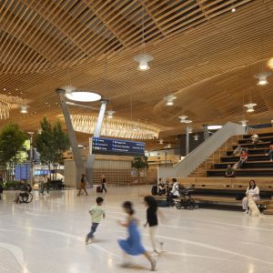 kids running among travelers at airport