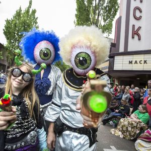 people dressed as aliens at a parade